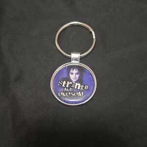 Purple 'Strange and Unusual' Beetlejuice Keychain